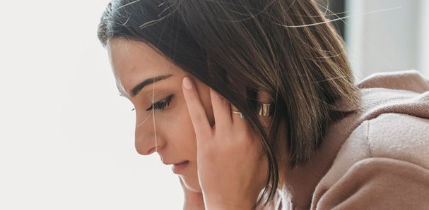 Woman feeling stressed out.